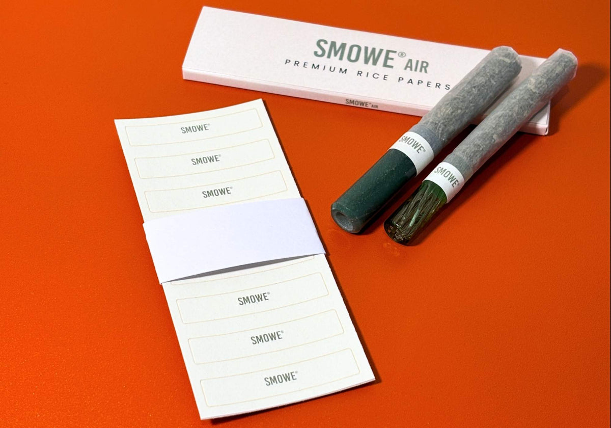 SMOWE J-Bands Papierbanderolen und SMOWE AIR Premium Rice Papers mit Glas-Tip Zubehör.